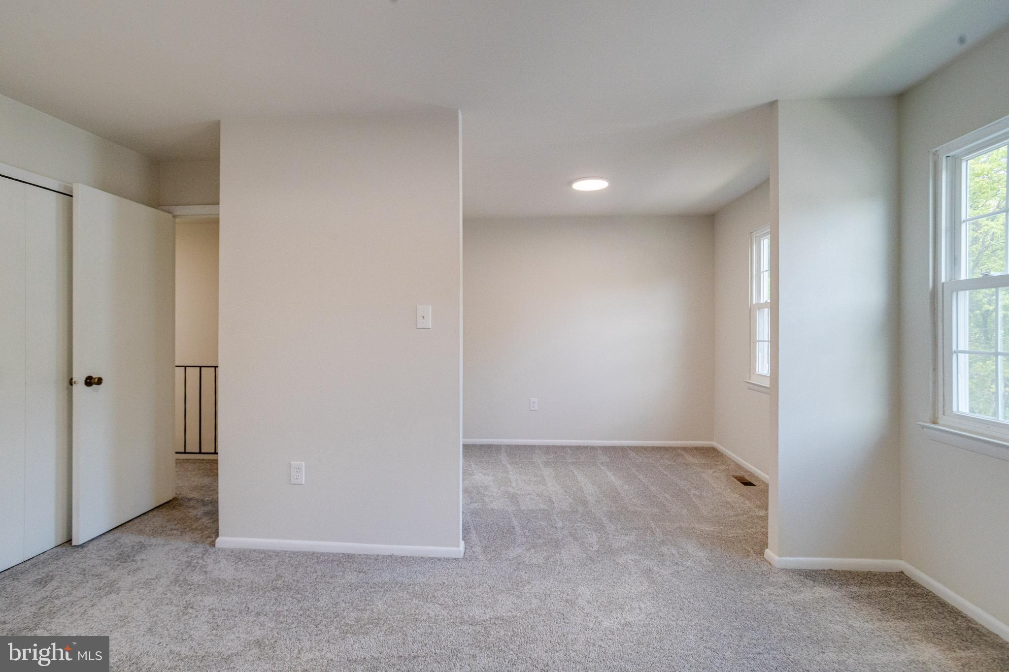 15925 Dorset Road, Unit 199 Laurel, MD 20707 - Photo 23 of 50 an empty room with windows and closet