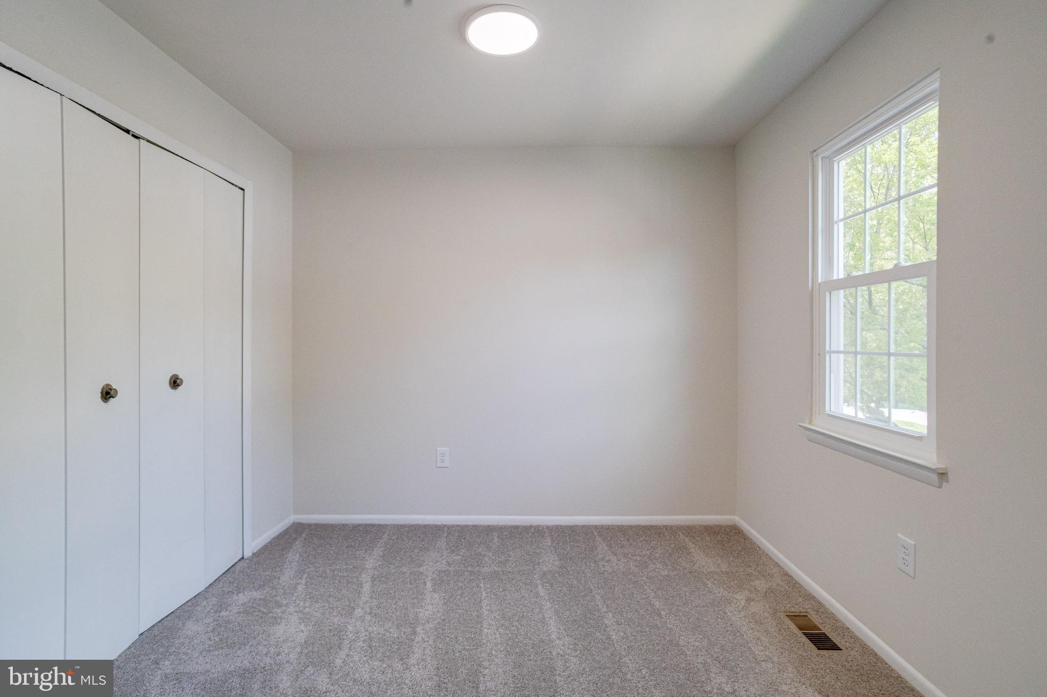 15925 Dorset Road, Unit 199 Laurel, MD 20707 - Photo 26 of 50 an empty room with windows
