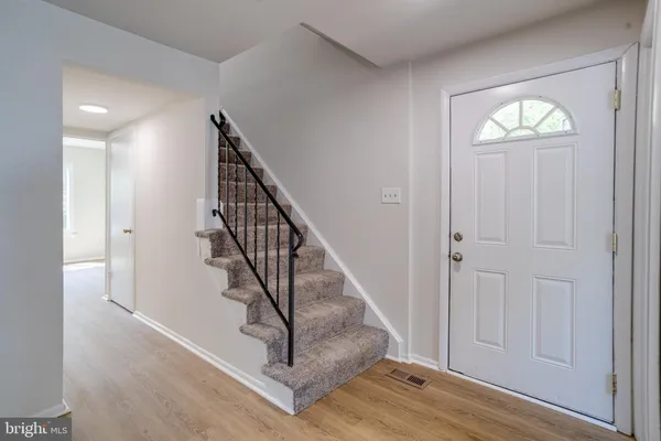 a view of entryway with wooden floor