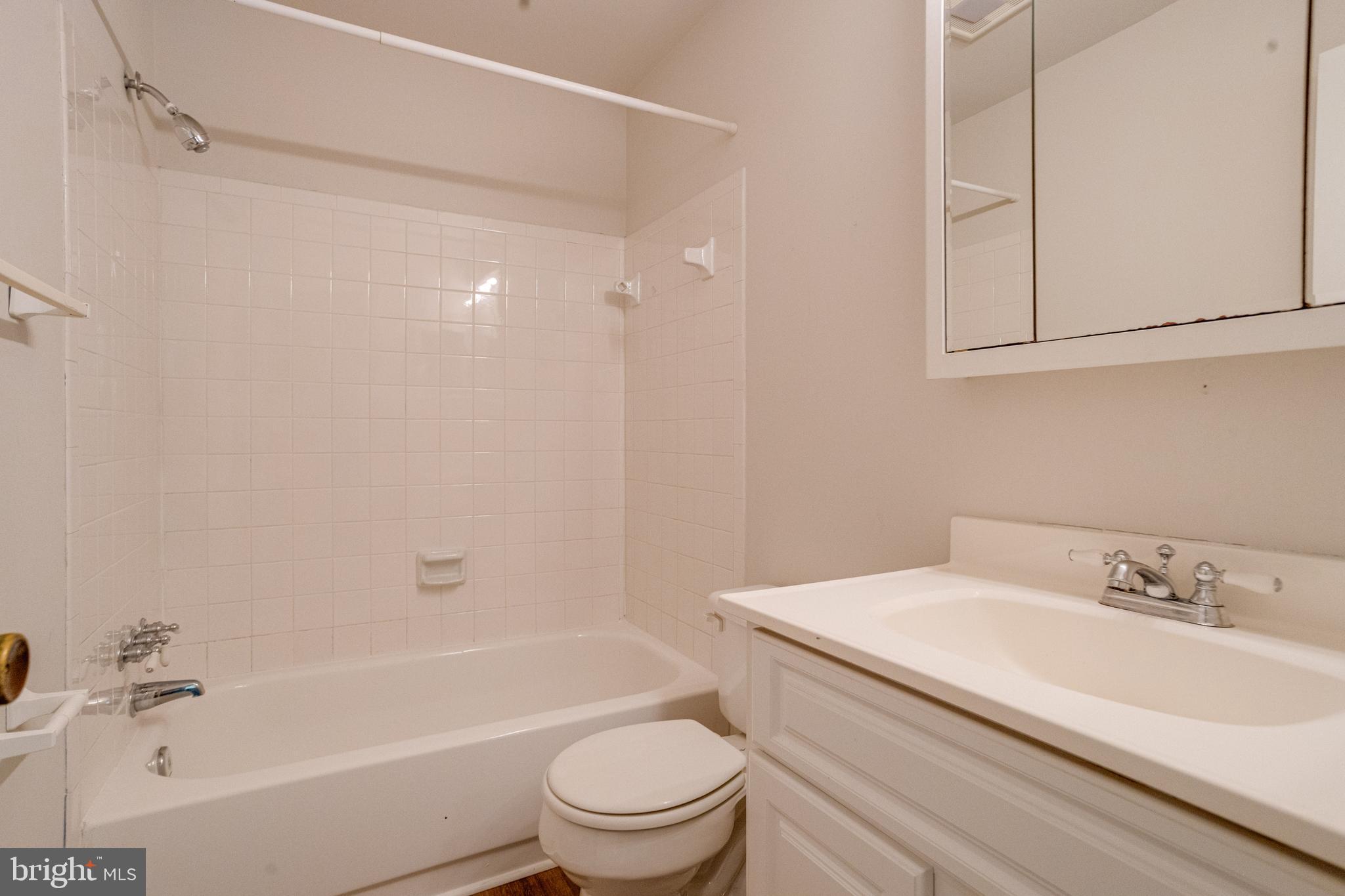 15925 Dorset Road, Unit 199 Laurel, MD 20707 - Photo 38 of 50 a bathroom with a sink a toilet and a bathtub