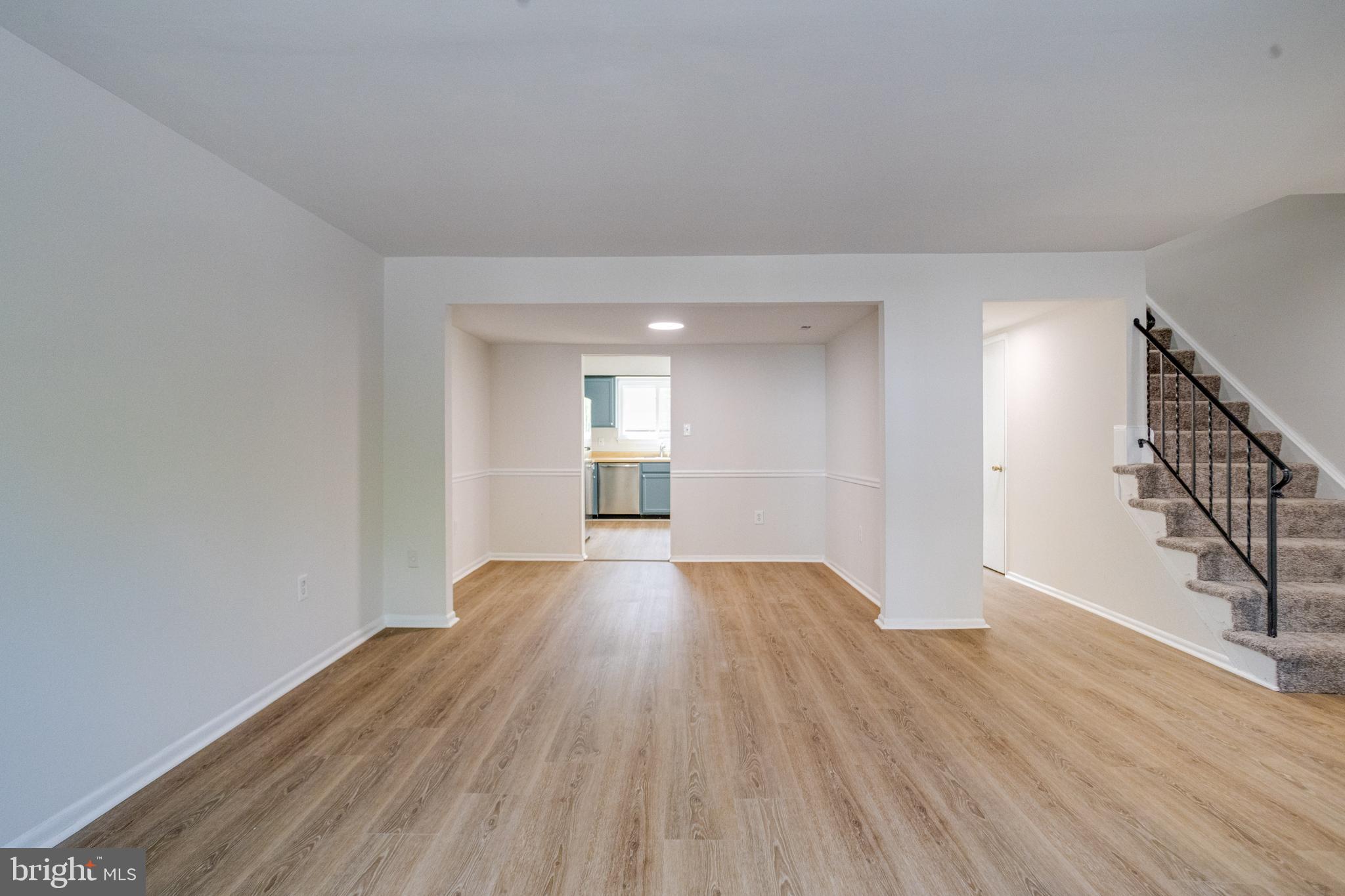 15925 Dorset Road, Unit 199 Laurel, MD 20707 - Photo 8 of 50 a view of empty room with wooden floor and fan