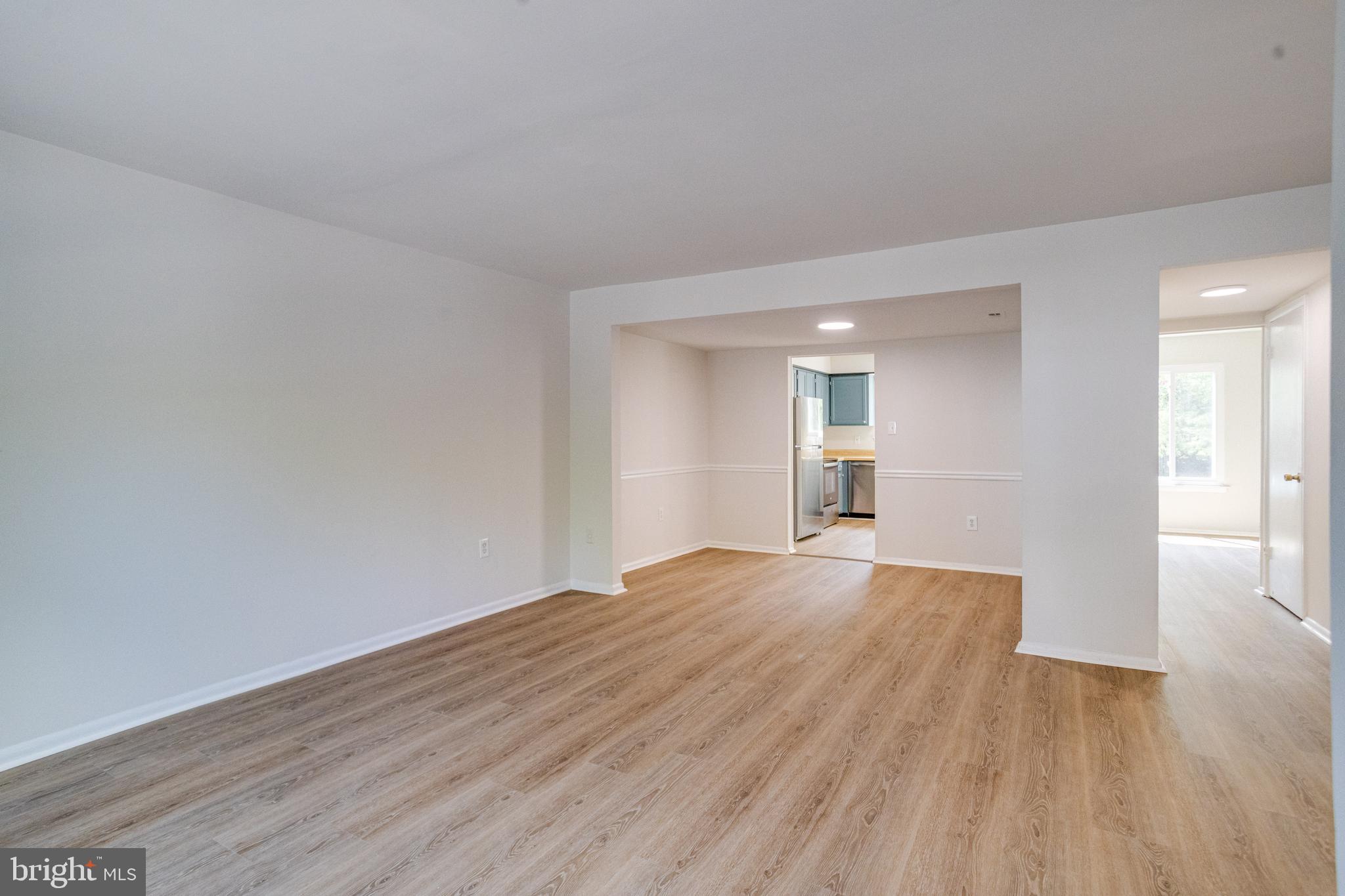 15925 Dorset Road, Unit 199 Laurel, MD 20707 - Photo 9 of 50 a view of empty room with wooden floor