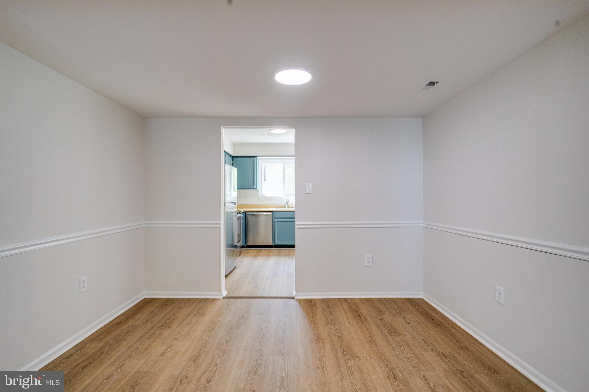 15925 Dorset Road, Unit 199 Laurel, MD 20707 - Photo 10 of 50 an empty room with wooden floor and windows