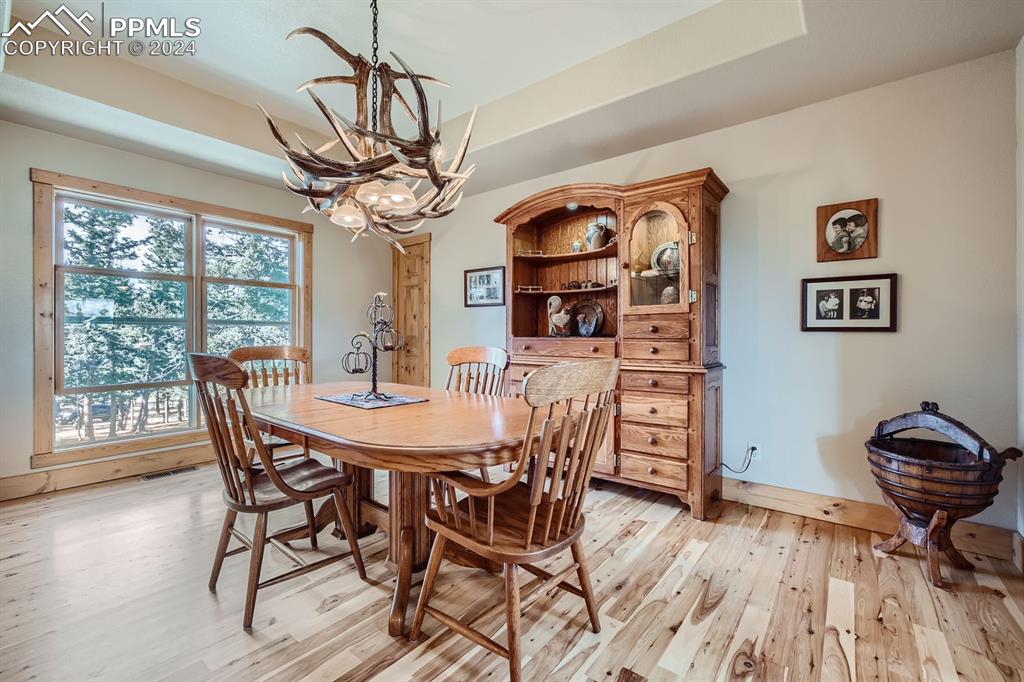 182 Joshua Road Divide, CO 80814 - Photo 13 of 41 a view of a dining room with furniture window and wooden floor