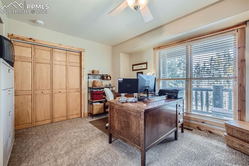 182 Joshua Road Divide, CO 80814 - Photo 15 of 41 a view of a workspace with furniture and a window