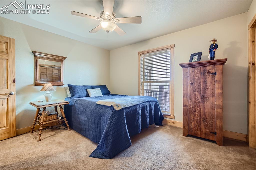 182 Joshua Road Divide, CO 80814 - Photo 18 of 41 a bed room with a bed and a window