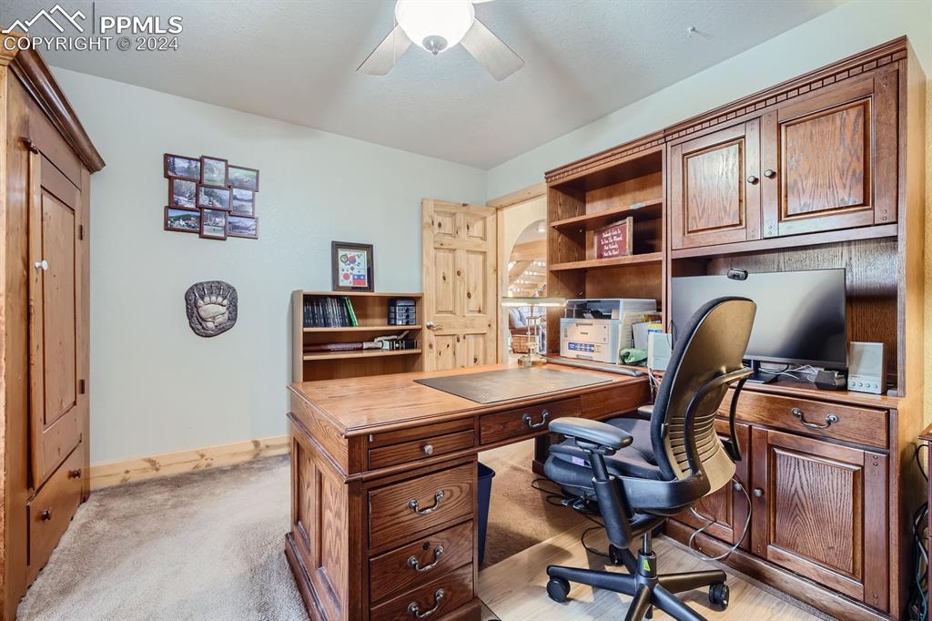 182 Joshua Road Divide, CO 80814 - Photo 20 of 41 a view of a workspace with furniture and a window