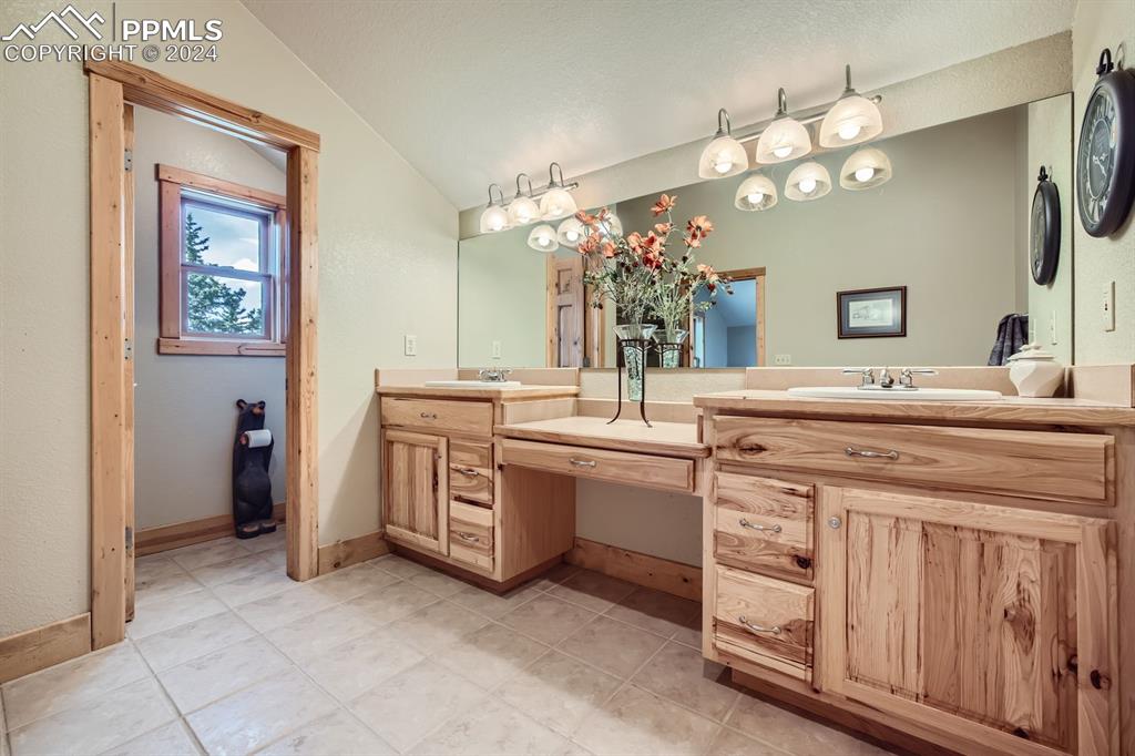 182 Joshua Road Divide, CO 80814 - Photo 23 of 41 a bathroom with a sink and a mirror