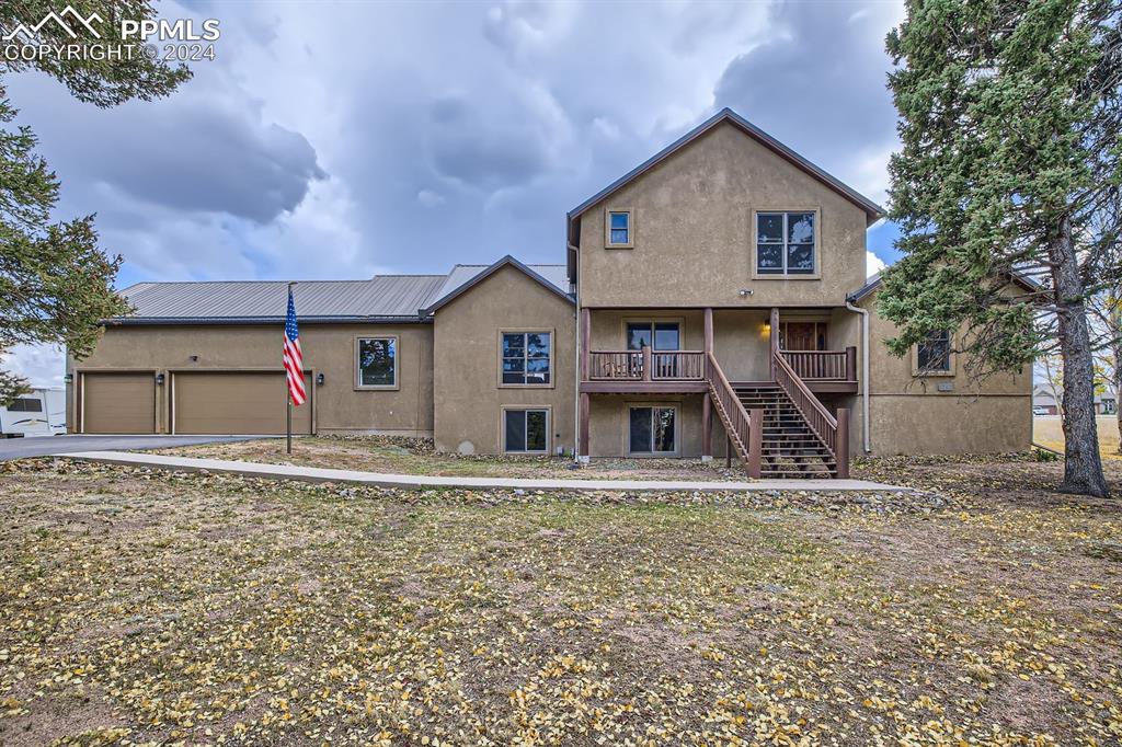 182 Joshua Road Divide, CO 80814 - Photo 27 of 41 a front view of a house with a yard