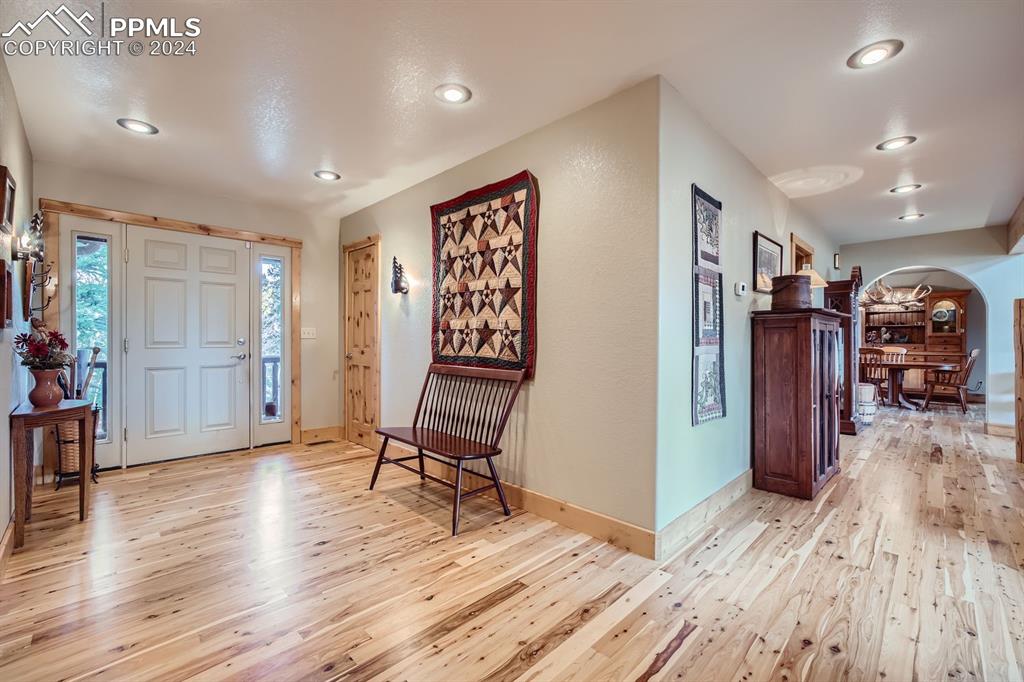 182 Joshua Road Divide, CO 80814 - Photo 3 of 41 a view of a hallway with wooden floor and furniture