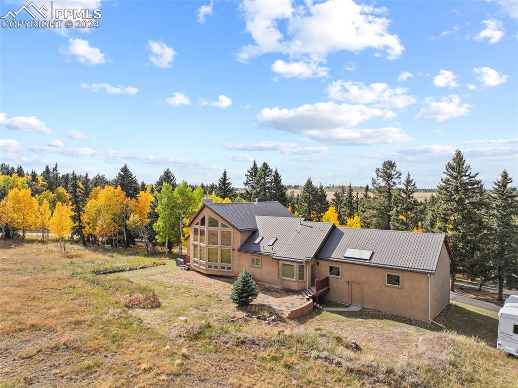 182 Joshua Road Divide, CO 80814 - Photo 32 of 41 an aerial view of a house with swimming pool and sitting space
