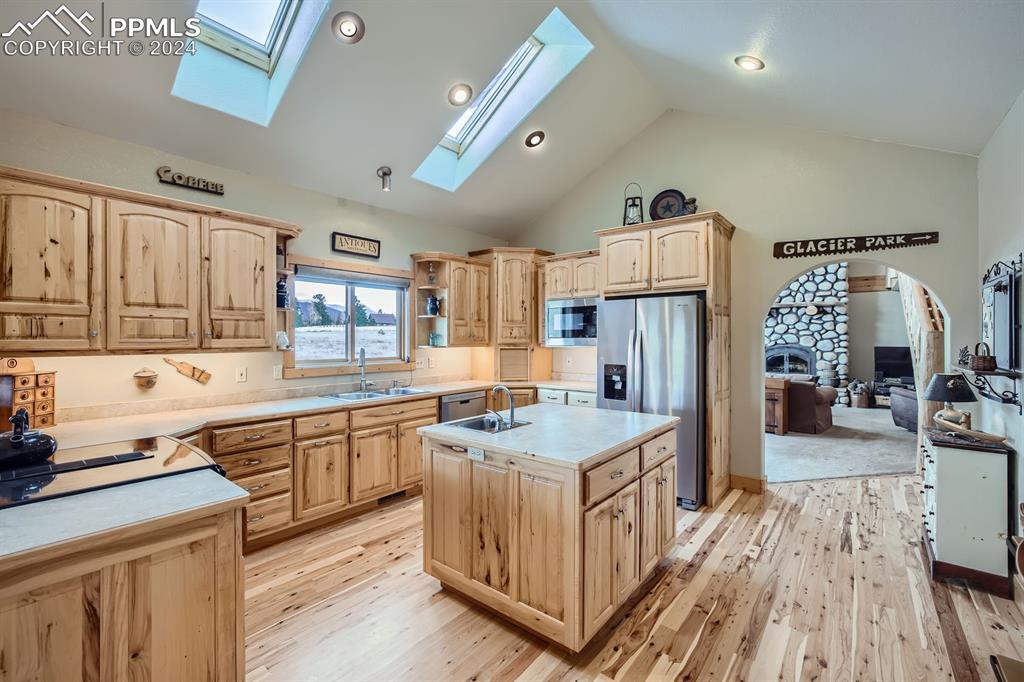 182 Joshua Road Divide, CO 80814 - Photo 7 of 41 a kitchen with stainless steel appliances granite countertop a sink stove and refrigerator