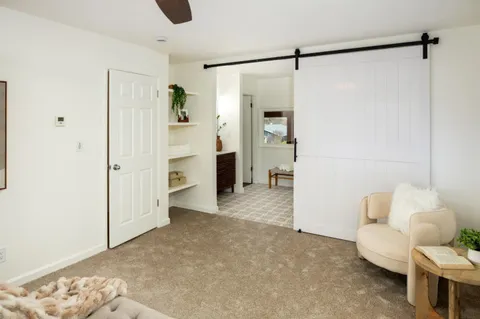 a view of a livingroom with furniture and cabinet