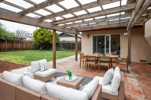 a view of yard with patio