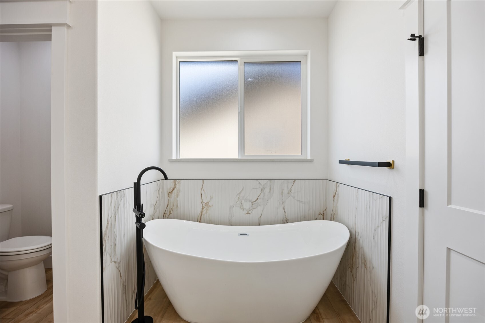 2394 Hunters Street Ephrata, WA 98823 - Photo 21 of 40 a white bath tub sitting next to a toilet