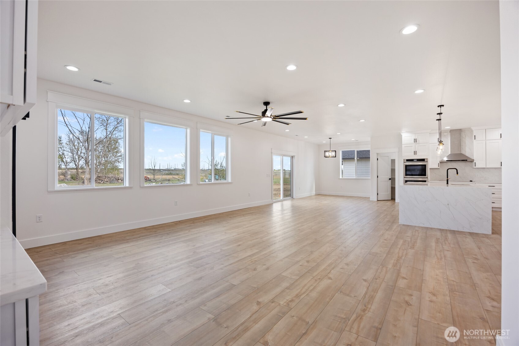 2394 Hunters Street Ephrata, WA 98823 - Photo 5 of 40 a view of a kitchen with furniture and wooden floor