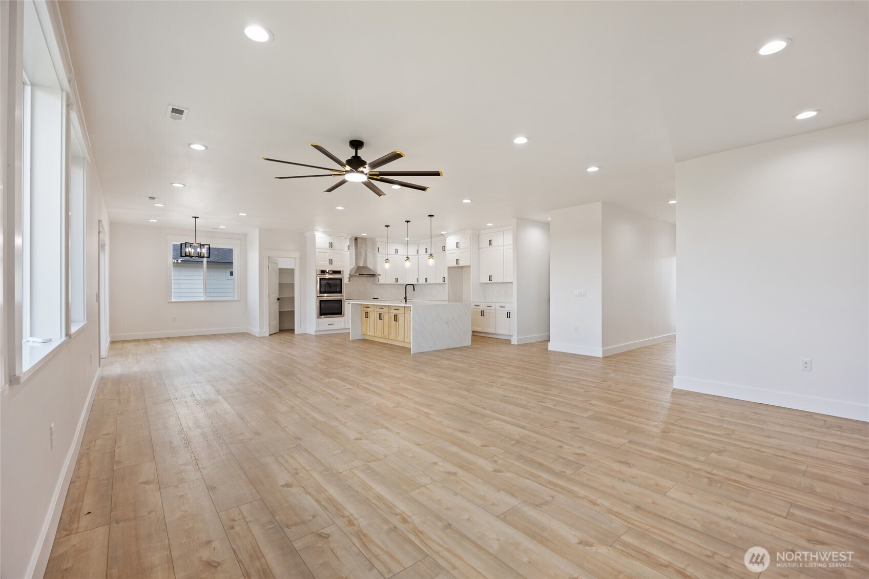 2394 Hunters Street Ephrata, WA 98823 - Photo 6 of 40 a view of a kitchen with a sink and a refrigerator