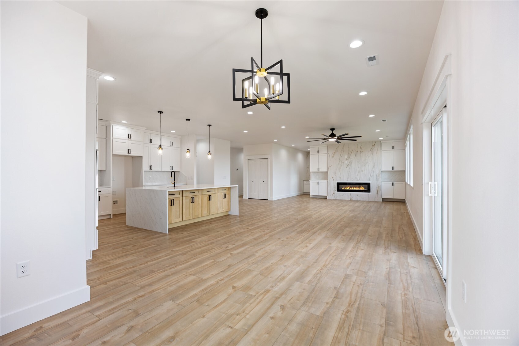 2394 Hunters Street Ephrata, WA 98823 - Photo 7 of 40 a view of a kitchen with a sink and a refrigerator