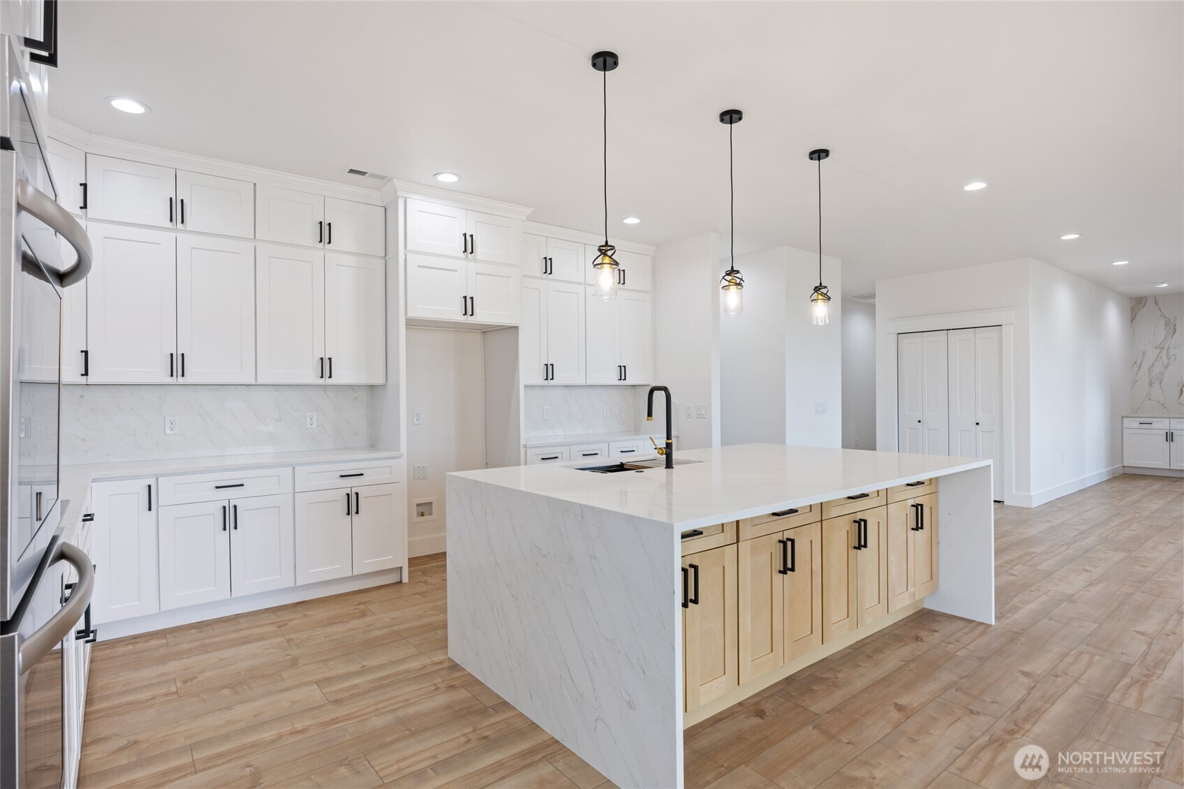 2394 Hunters Street Ephrata, WA 98823 - Photo 9 of 40 a kitchen with stainless steel appliances granite countertop a sink a stove and a refrigerator