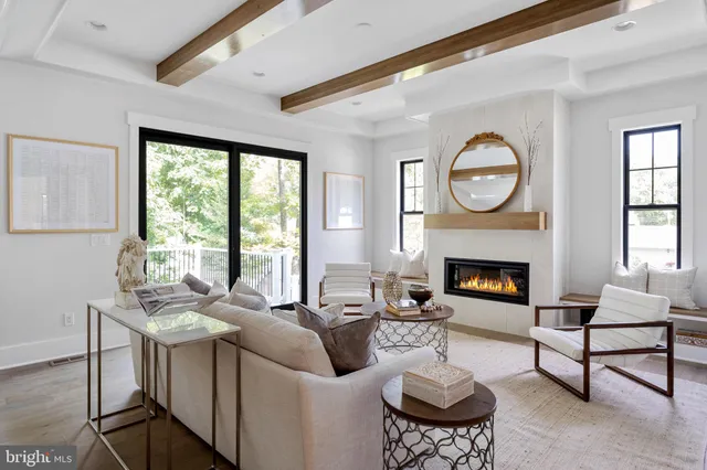 a white bath tub sitting in a bathroom next to a window