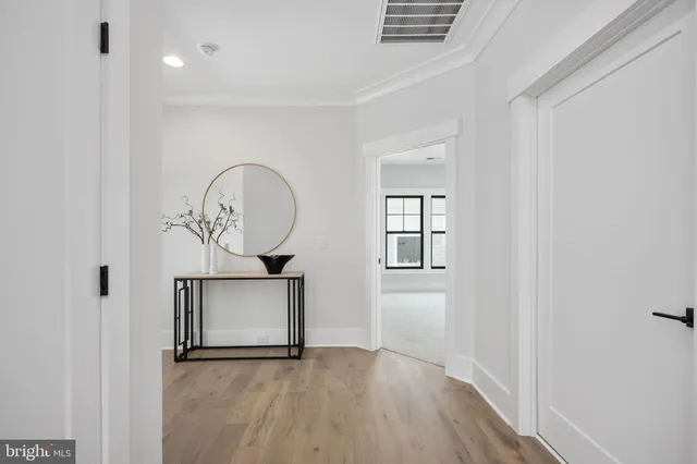 a bathroom with a toilet a sink and a mirror