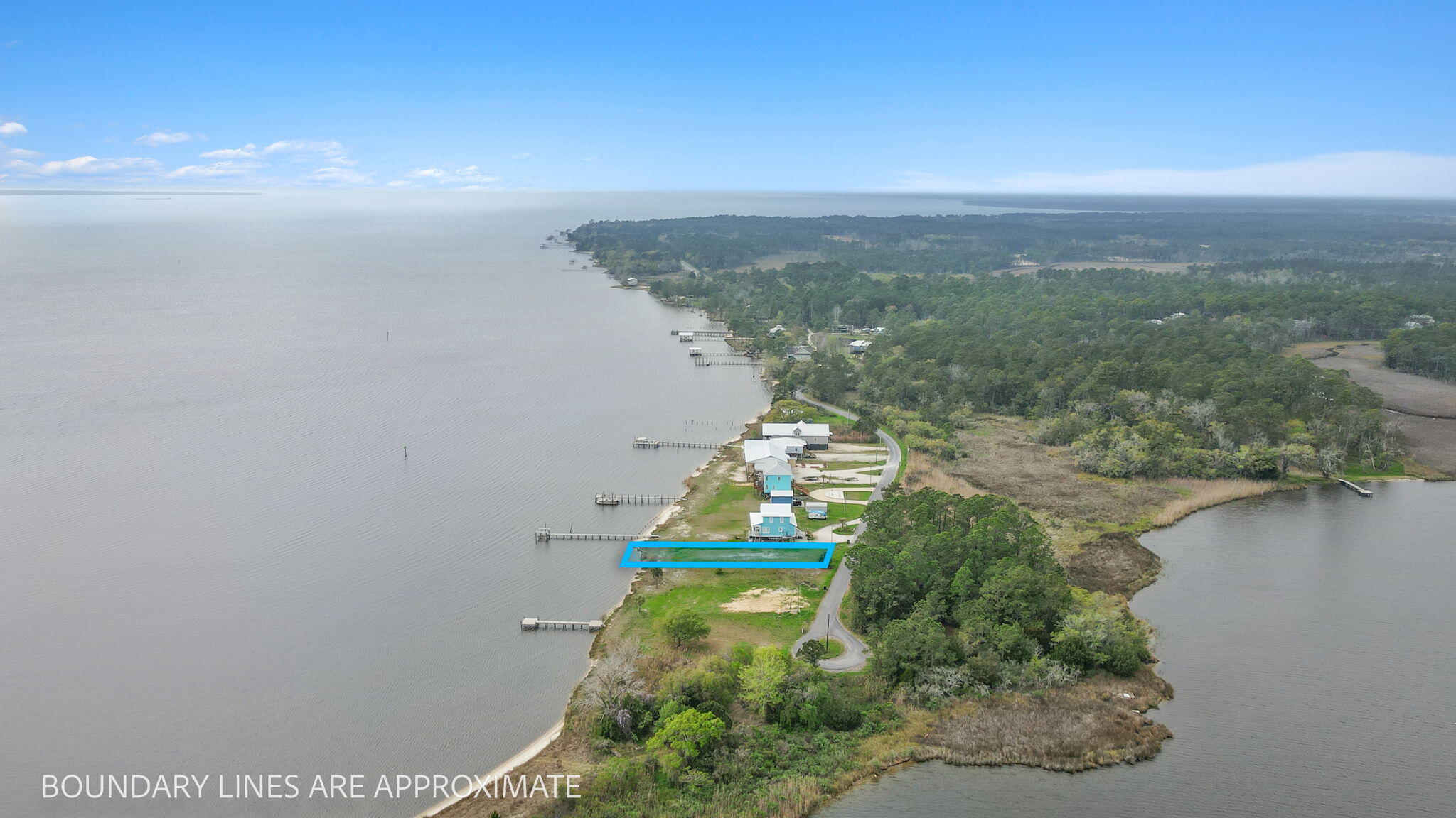 554 Beatrice Point Road Freeport, FL 32439 - Photo 13 of 22 a view of a lake with a city