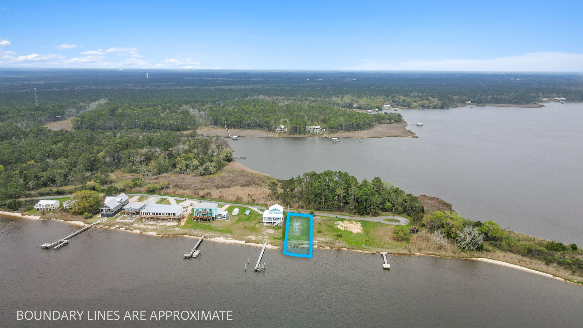 554 Beatrice Point Road Freeport, FL 32439 - Photo 9 of 22 a view of a lake with a city