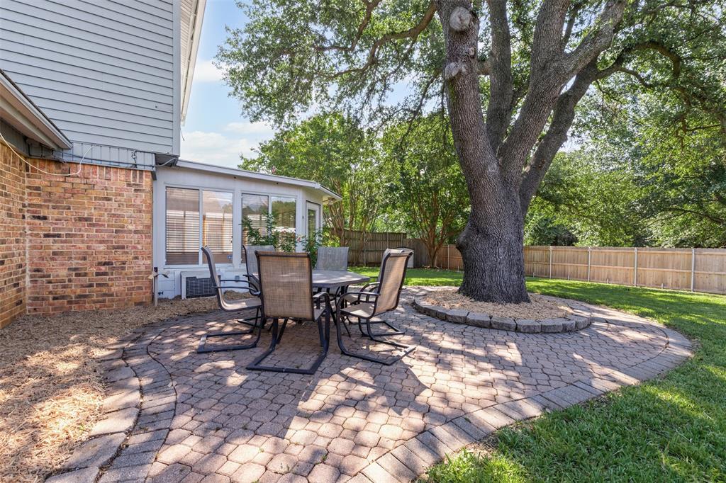 a view of a outdoor space with a patio and backyard