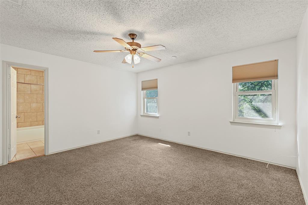 1013 Mockingbird Drive Grapevine, TX 76051 - Photo 17 of 26 a view of room with a ceiling fan and a window