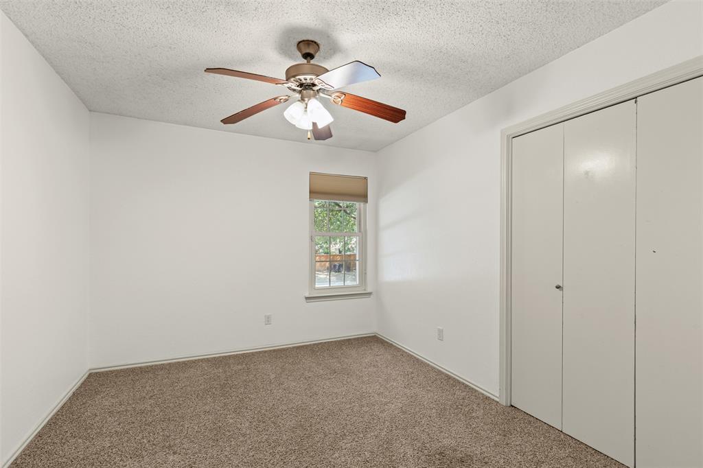 1013 Mockingbird Drive Grapevine, TX 76051 - Photo 20 of 26 an empty room with windows and fan