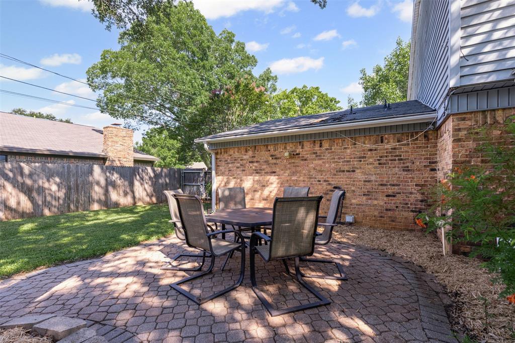 1013 Mockingbird Drive Grapevine, TX 76051 - Photo 23 of 26 a view of an outdoor sitting area with chairs