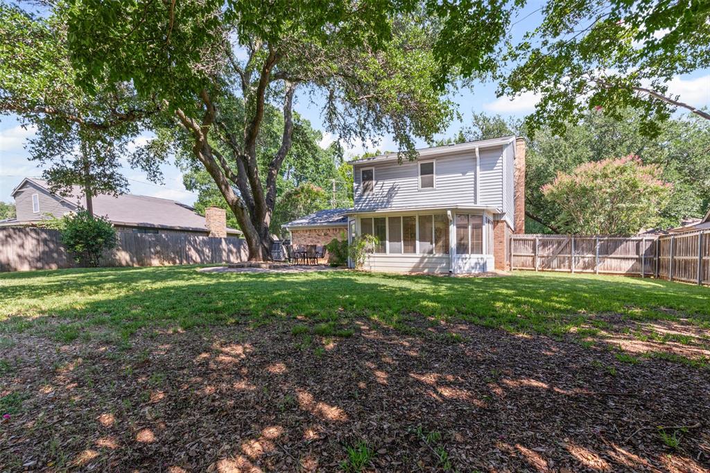 1013 Mockingbird Drive Grapevine, TX 76051 - Photo 24 of 26 a view of a house with a yard