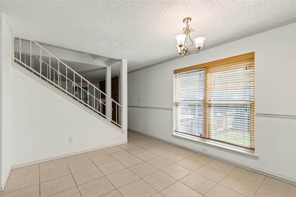 1013 Mockingbird Drive Grapevine, TX 76051 - Photo 9 of 26 a view of an entryway with staircase
