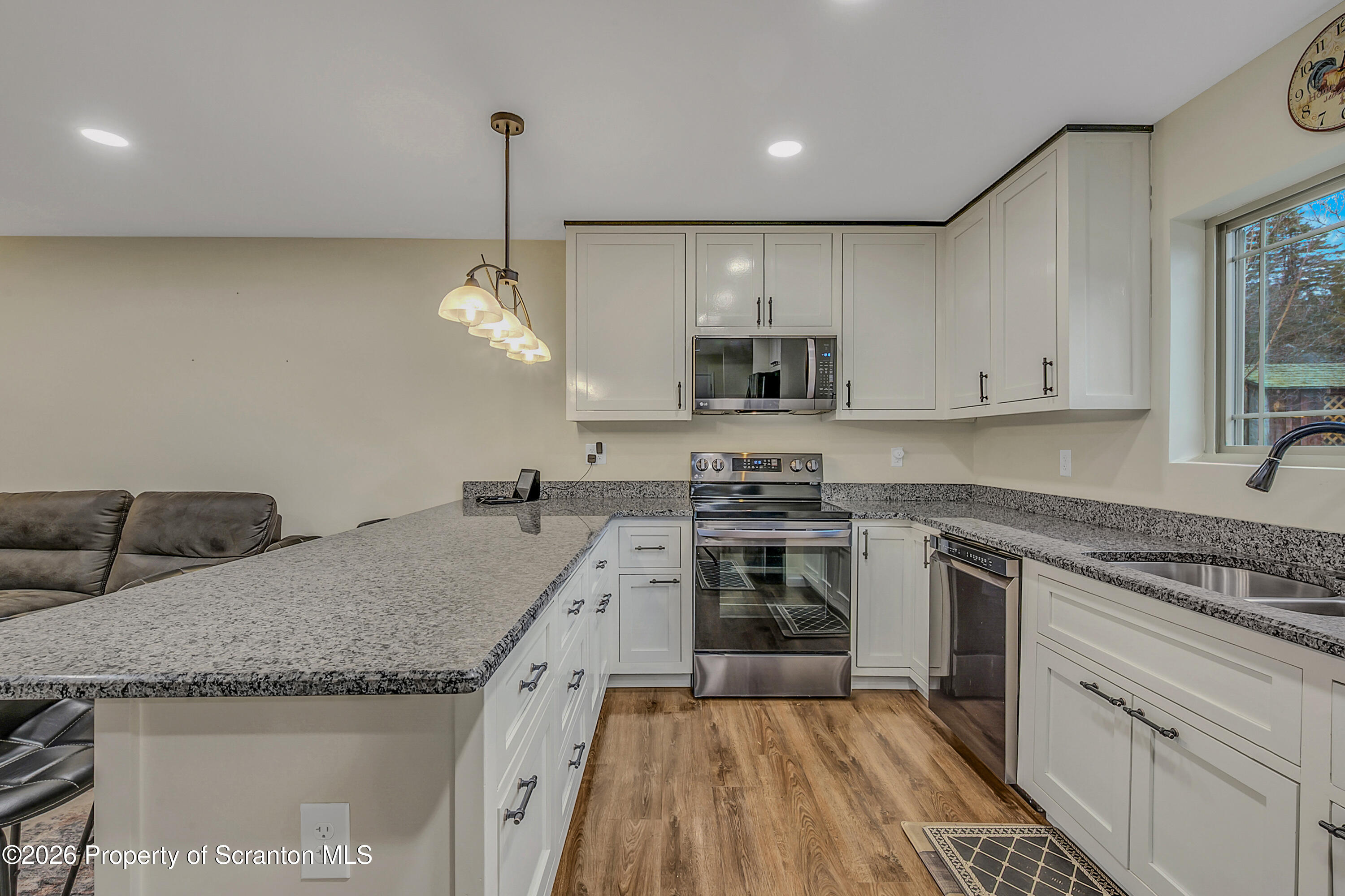 8 Hermel Street Scott Township, PA 18447 - Photo 17 of 38 a kitchen with stainless steel appliances granite countertop a sink stove and refrigerator