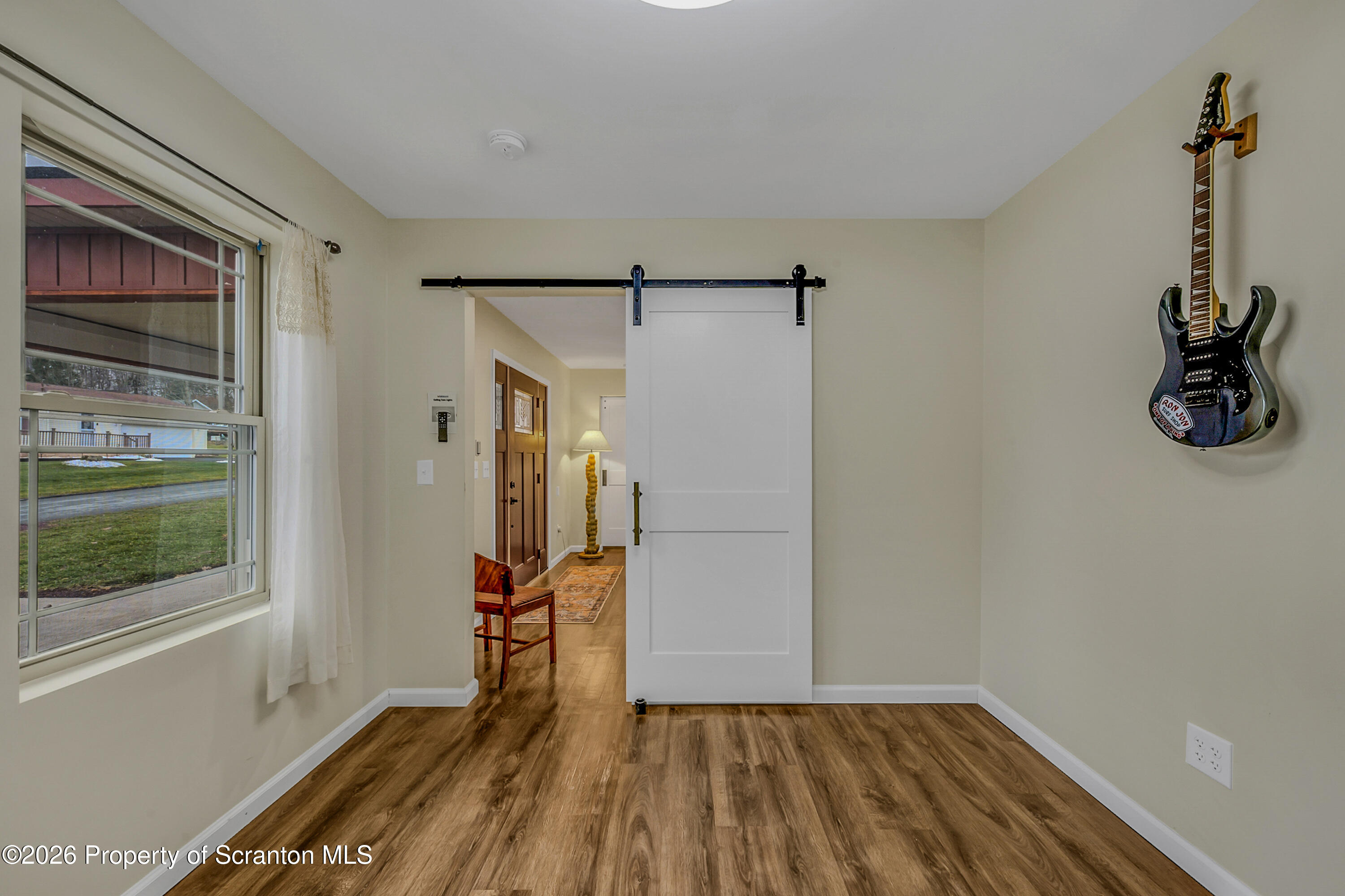 8 Hermel Street Scott Township, PA 18447 - Photo 22 of 38 a view of empty room with wooden floor and fan