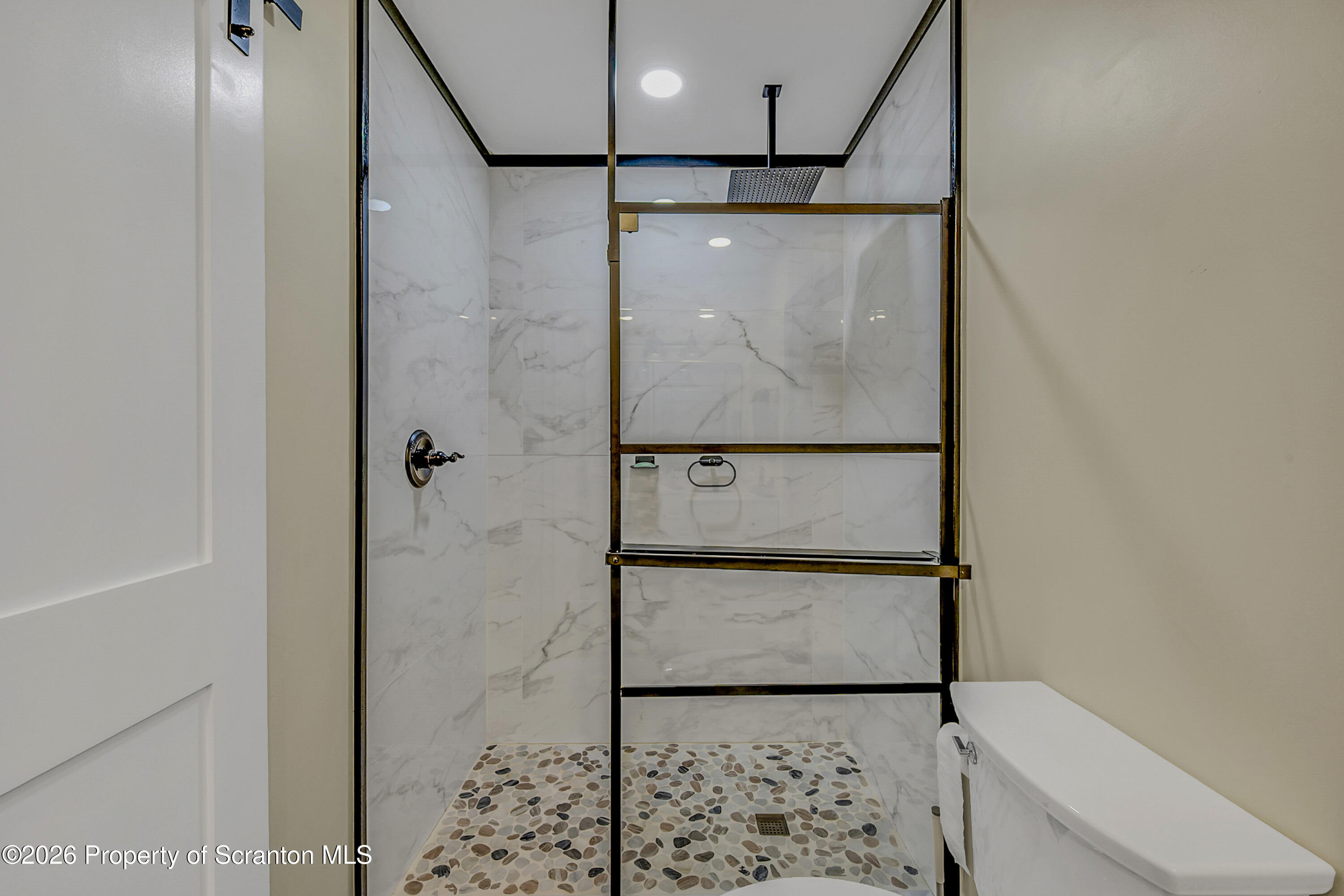 8 Hermel Street Scott Township, PA 18447 - Photo 24 of 38 a bathroom with a shower and a toilet