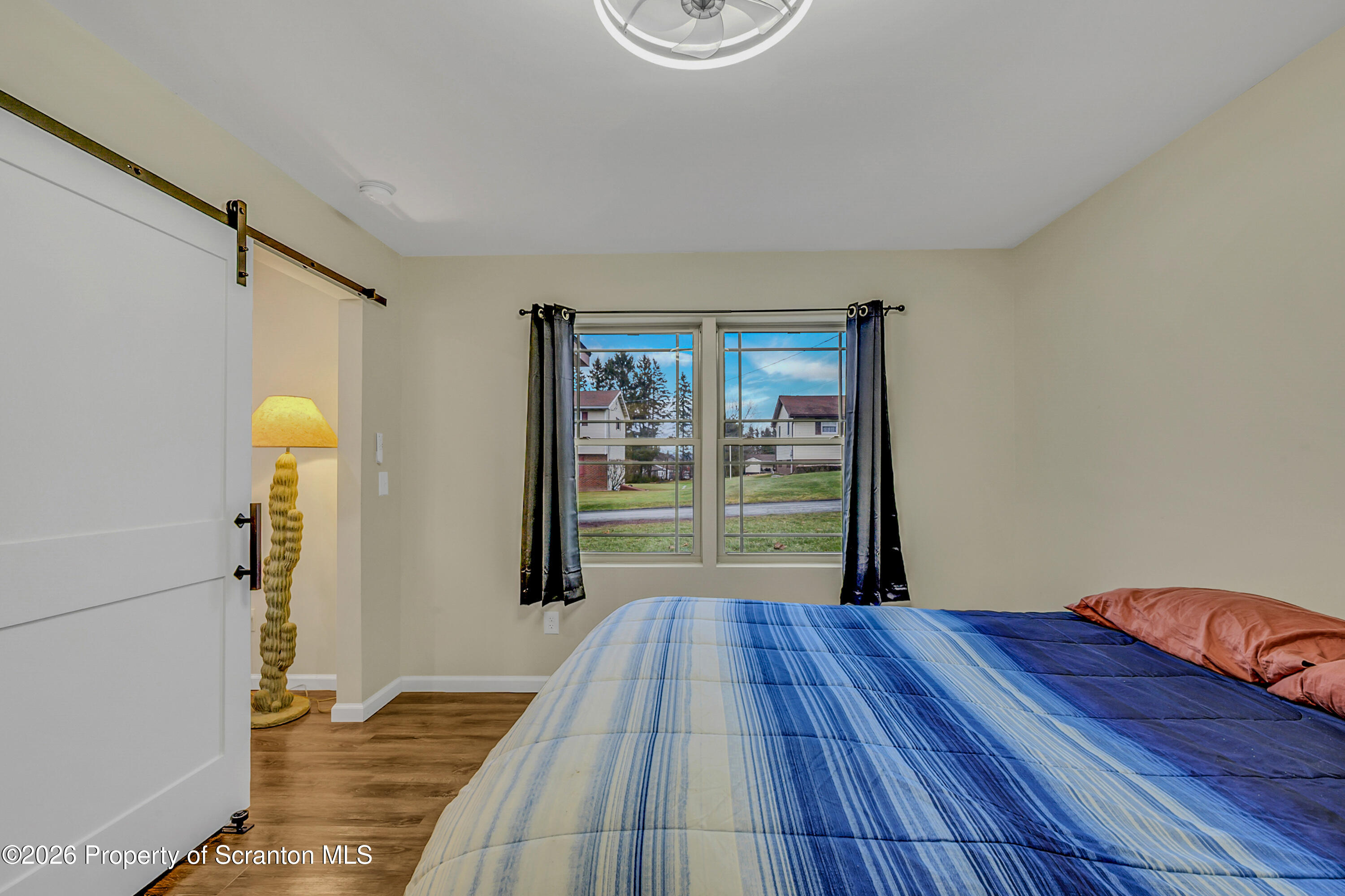 8 Hermel Street Scott Township, PA 18447 - Photo 28 of 38 a room with wooden floor and couch