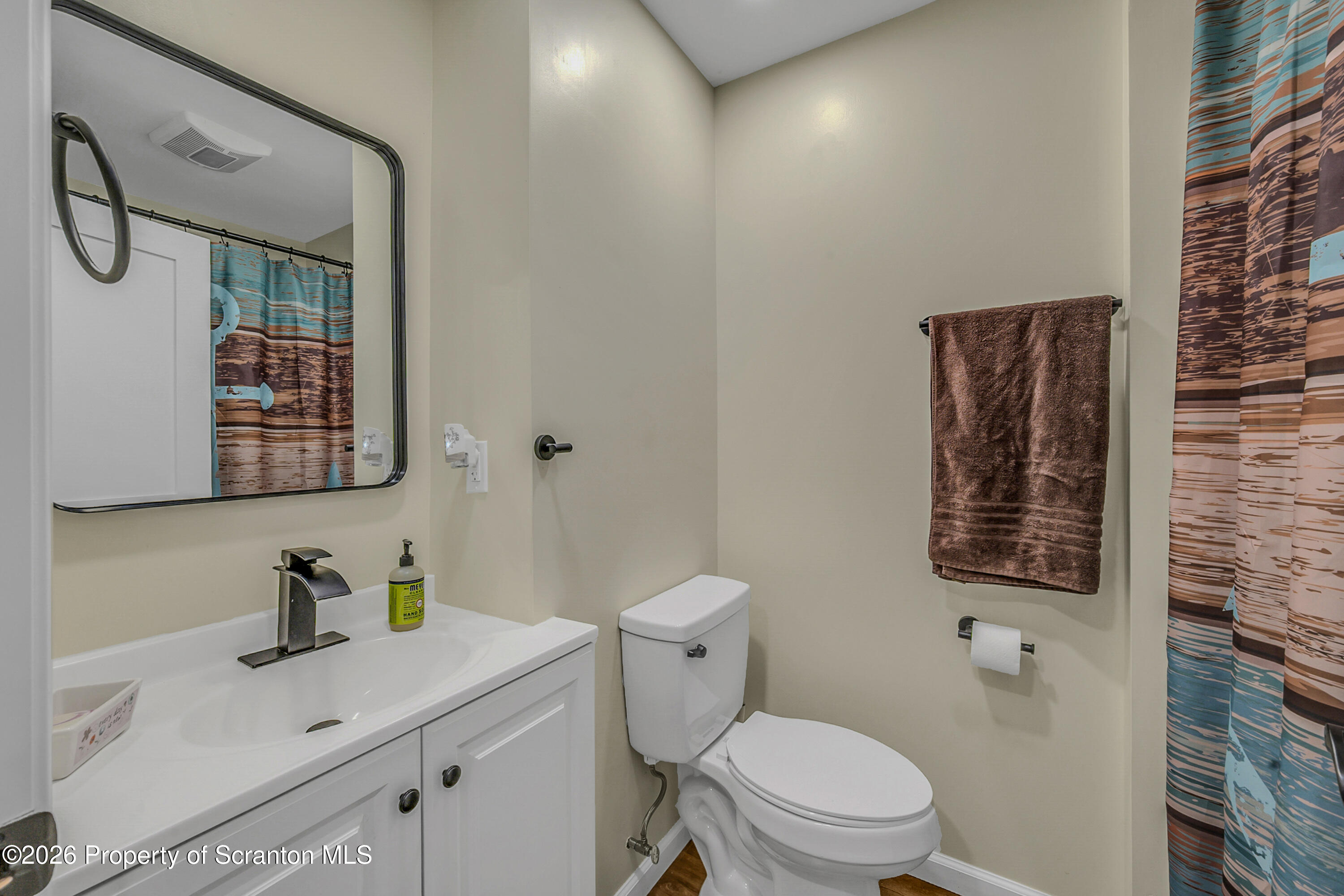 8 Hermel Street Scott Township, PA 18447 - Photo 36 of 38 a bathroom with a granite countertop sink a toilet and a mirror