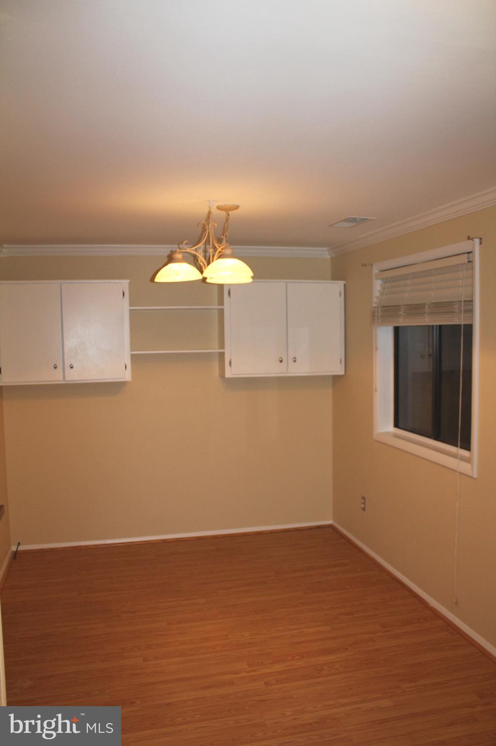 157 Dunlap Road Pasadena, MD 21122 - Photo 4 of 29 Dining Room w/Crown Molding & Pergo Flrs