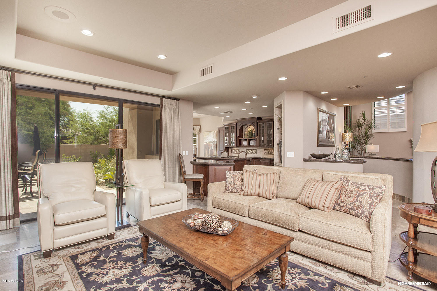 7425 East Gainey Ranch Road, Unit 52 Scottsdale, AZ 85258 - Photo 8 of 25 07 Family Room to Kitchen Bar and Patio