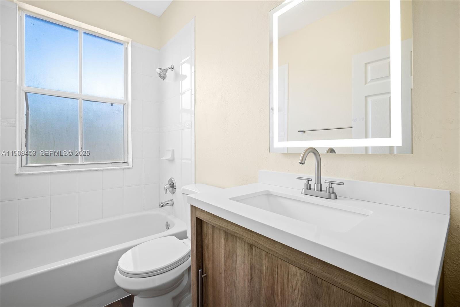 13834 Southwest 274th Terrace Homestead, FL 33032 - Photo 12 of 26 a bathroom with a sink toilet vanity and shower