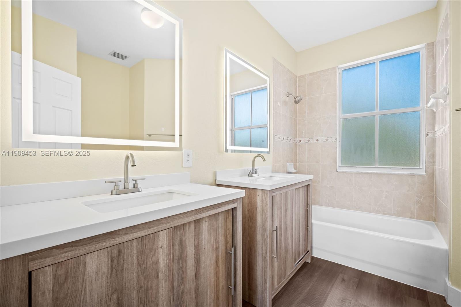 13834 Southwest 274th Terrace Homestead, FL 33032 - Photo 20 of 26 a bathroom with a sink a mirror and a bathtub