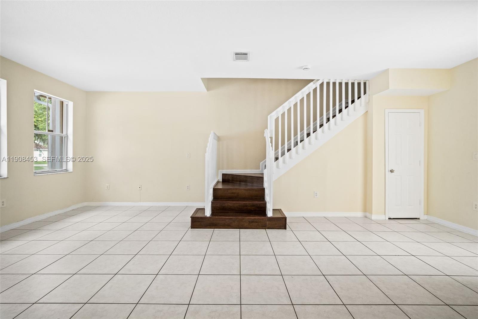 13834 Southwest 274th Terrace Homestead, FL 33032 - Photo 2 of 26 a view of an entryway with wooden floor