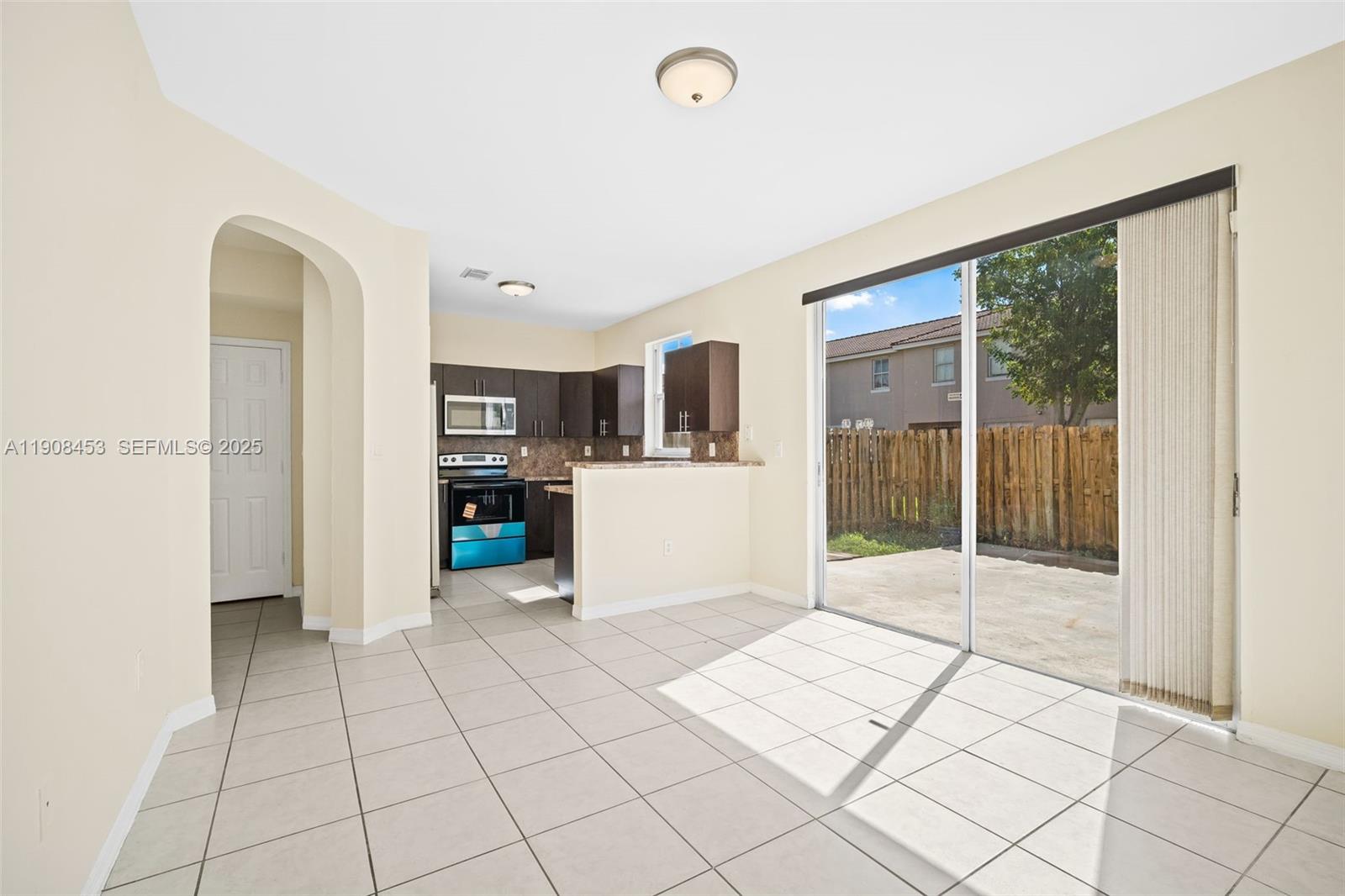 13834 Southwest 274th Terrace Homestead, FL 33032 - Photo 8 of 26 a view of kitchen with furniture and refrigerator