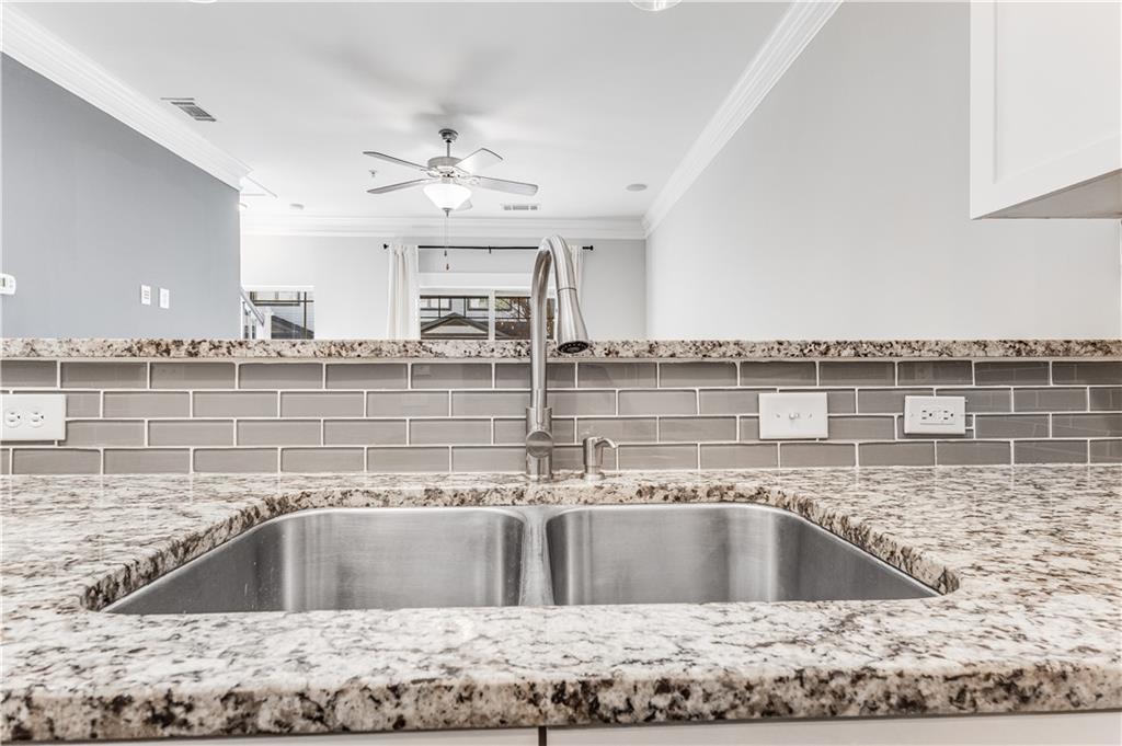 216 Semel Circle Northwest, Unit 355 Atlanta, GA 30309 - Photo 11 of 48 a view of a kitchen with a sink and microwave