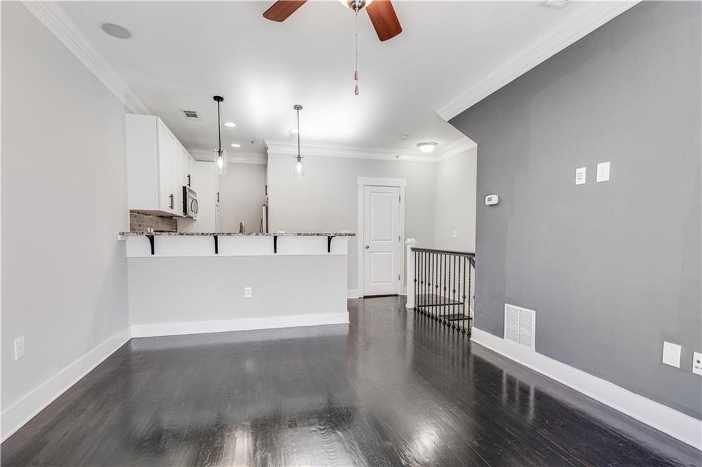 216 Semel Circle Northwest, Unit 355 Atlanta, GA 30309 - Photo 13 of 48 a view of a kitchen with a sink and wooden floor