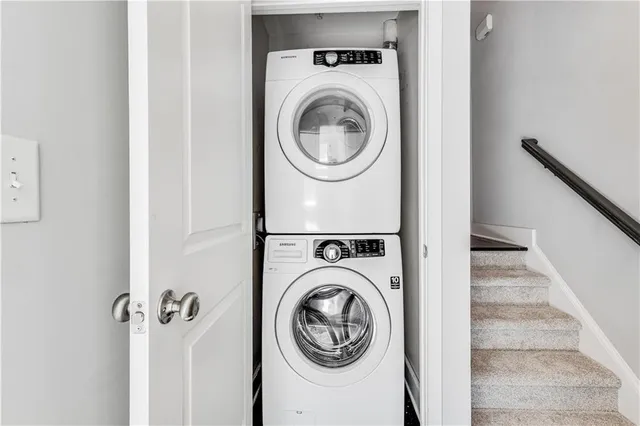 a view of a hallway with washer and dryer