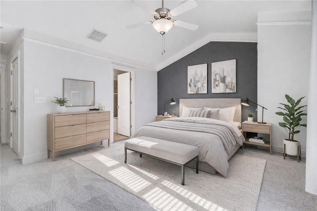 216 Semel Circle Northwest, Unit 355 Atlanta, GA 30309 - Photo 19 of 48 a bedroom with a bed and a chandelier