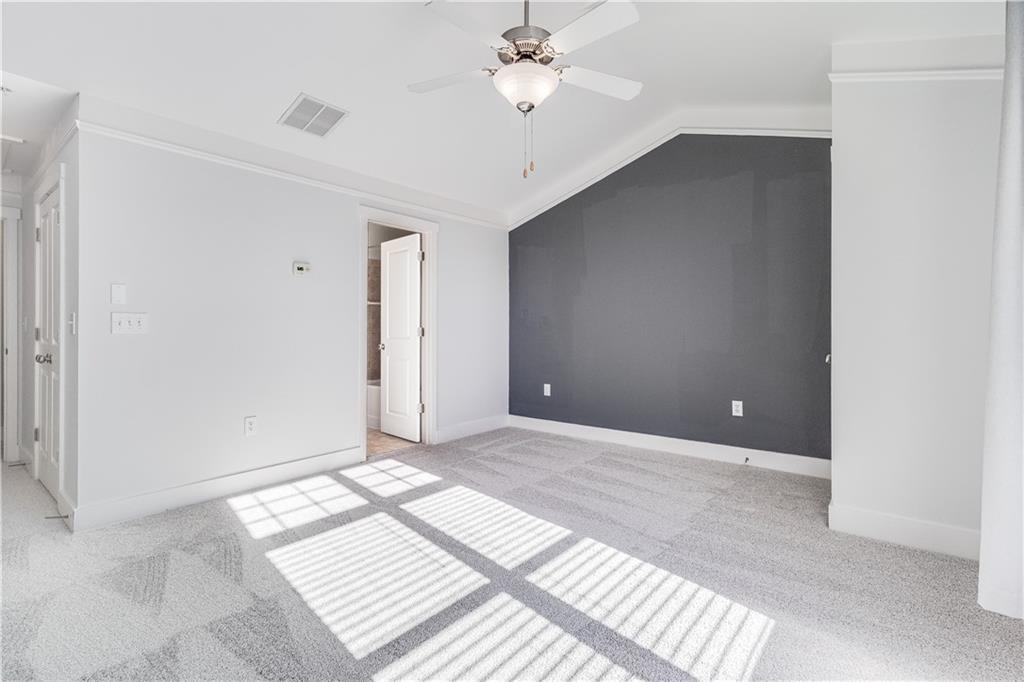 216 Semel Circle Northwest, Unit 355 Atlanta, GA 30309 - Photo 20 of 48 wooden floor in an empty room with a window