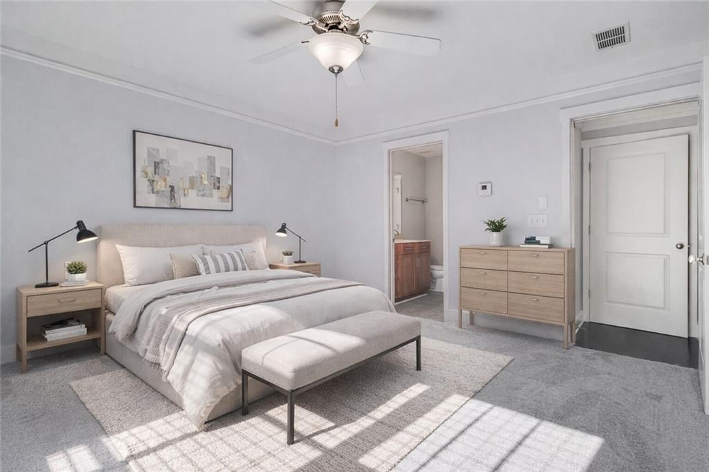 216 Semel Circle Northwest, Unit 355 Atlanta, GA 30309 - Photo 27 of 48 a spacious bedroom with a bed and a chandelier